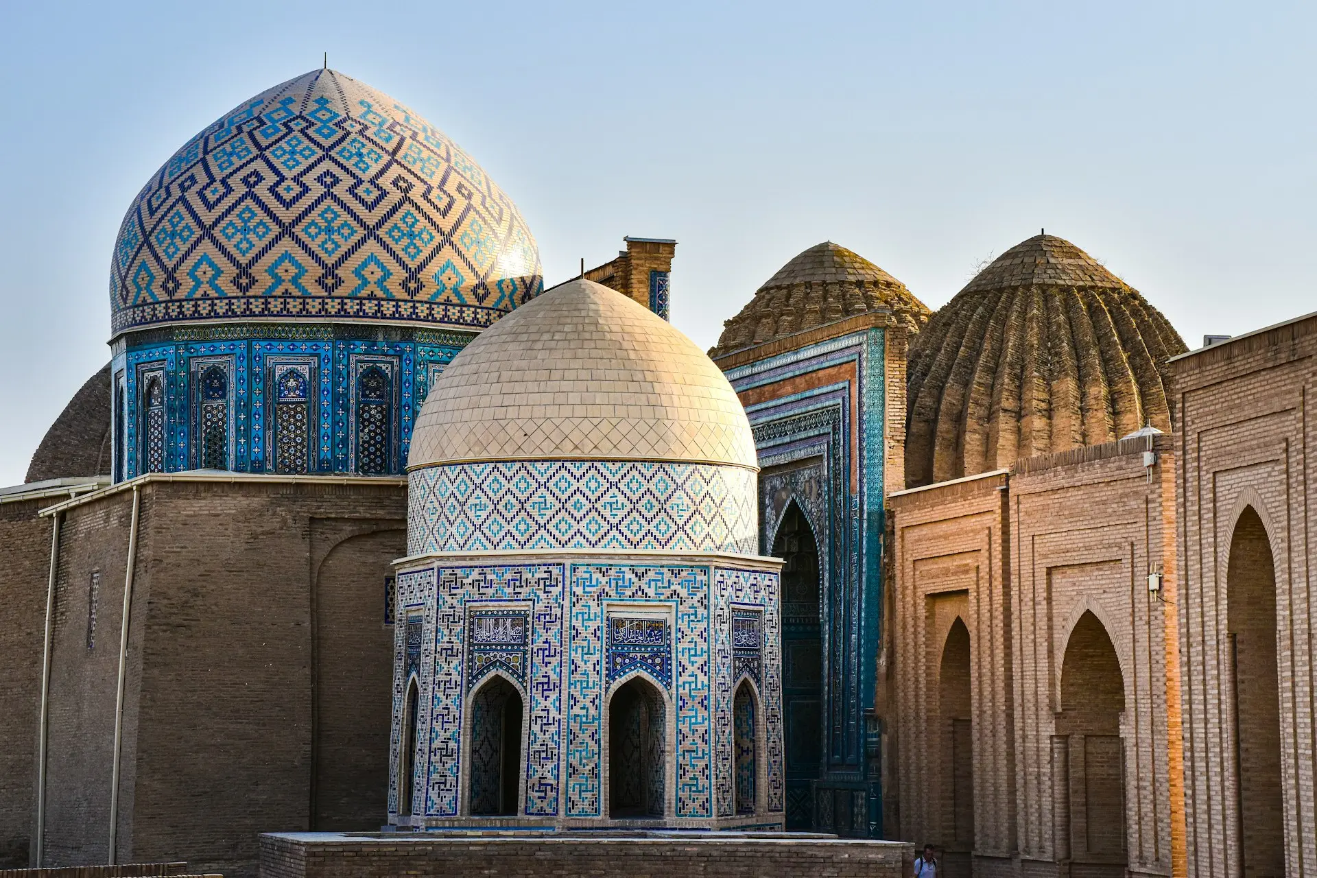 The intricate domes and vibrant blue mosaics of Samarkand, Uzbekistan, a city rich in Islamic art and history. These stunning structures represent the heart of the ancient Silk Road and its cultural heritage.