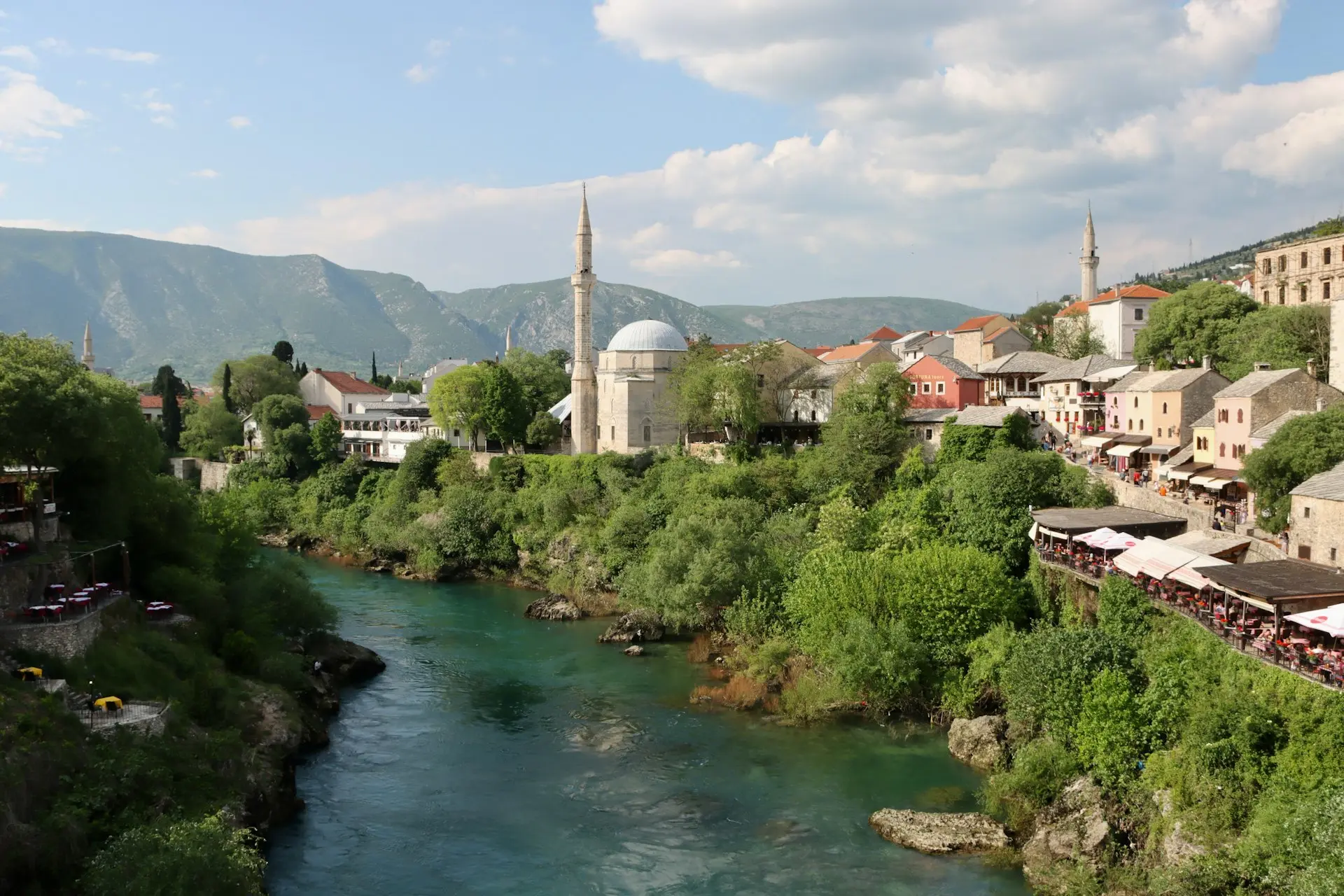 Scenic view of Bosnia’s Mostar with Neretva River and historic architecture.