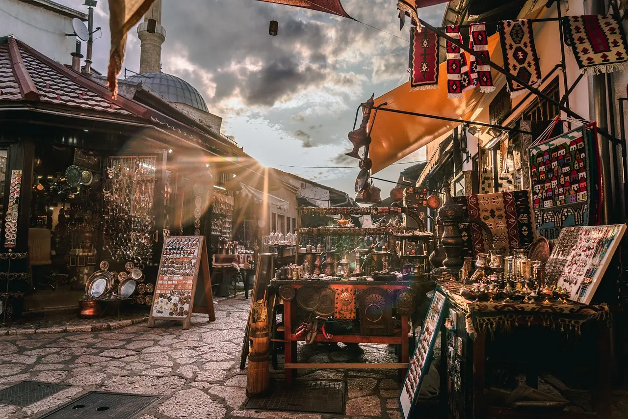 Traditional market in Bosnia's Baščaršija with crafts and textiles on display.